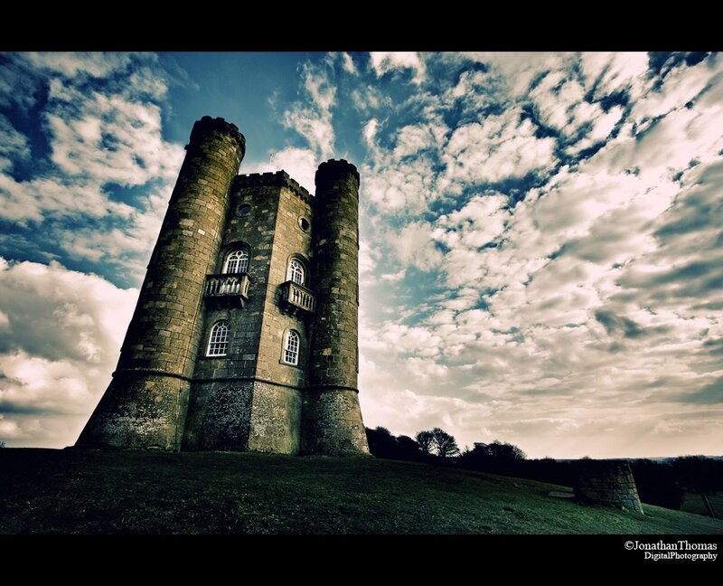 Castle tower under cloudy sky
