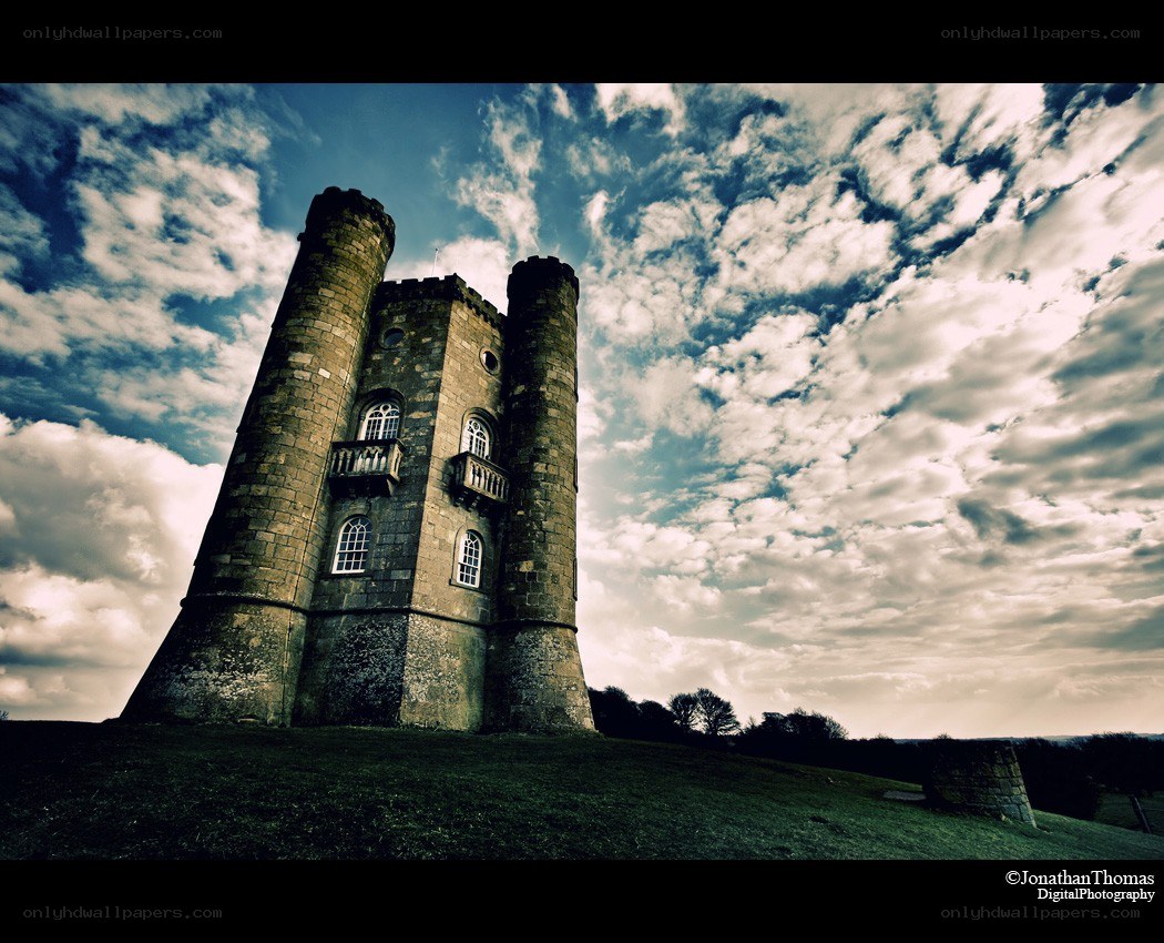 Castle tower under cloudy sky