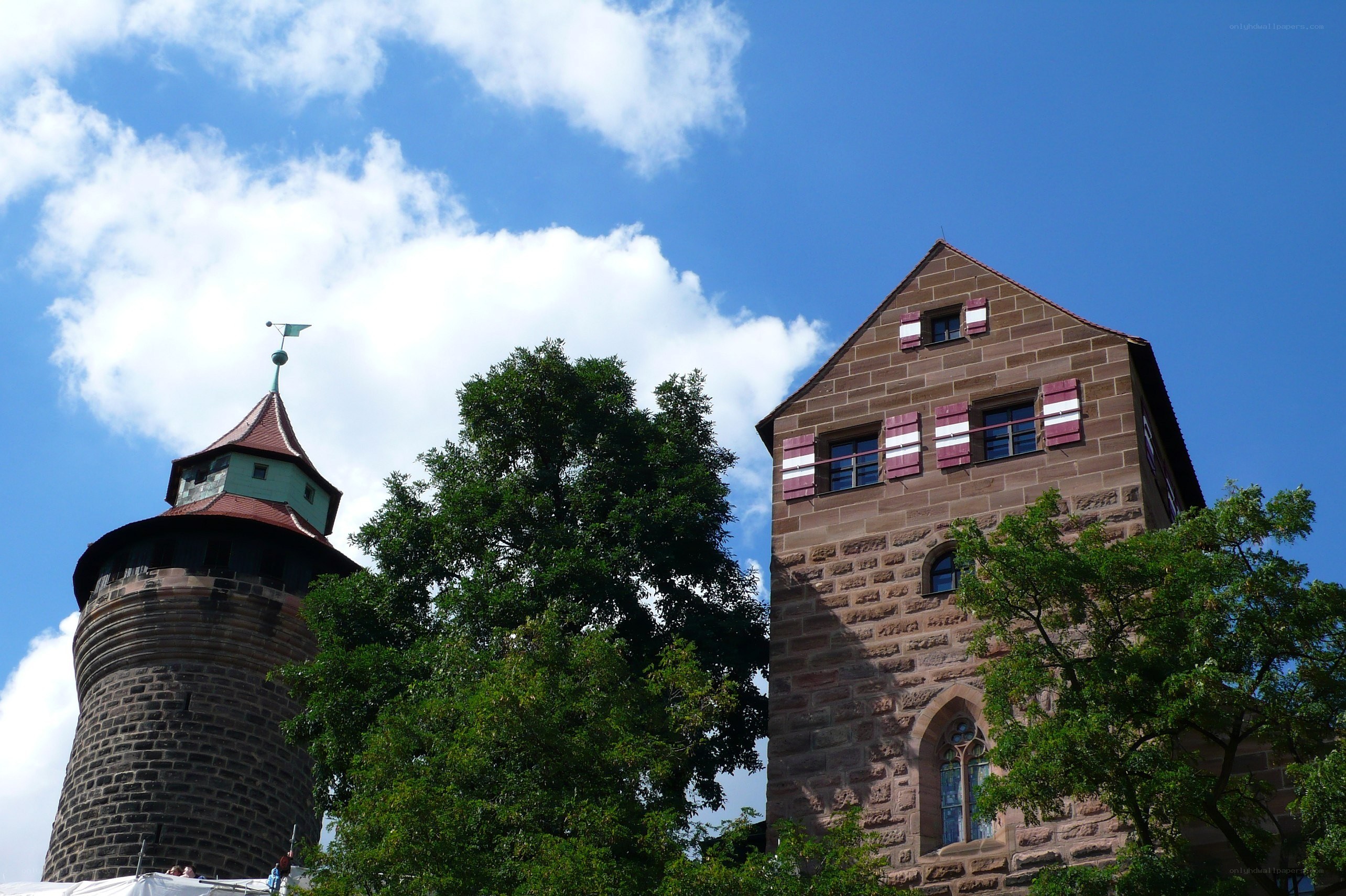 castle towers under blue sky