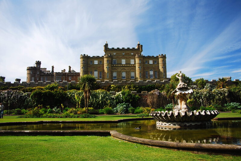 Castle with fountain in garden