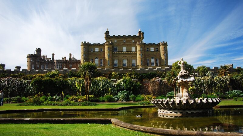 Castle with fountain in garden