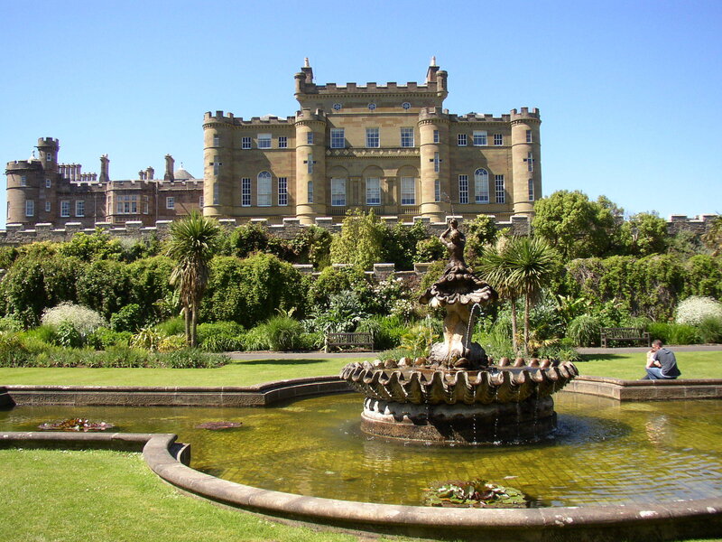 castle with fountain in garden