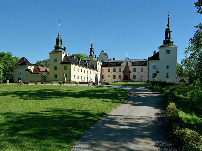 castle with green lawn and path