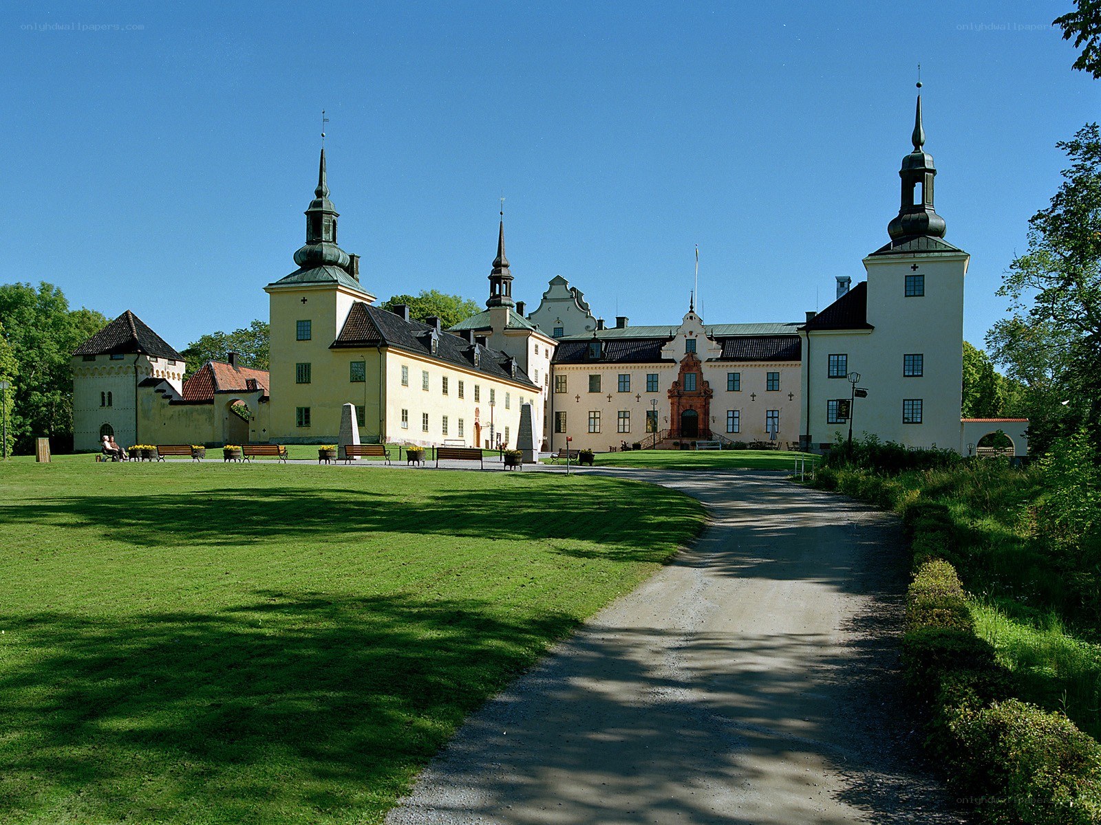 castle with green lawn and path