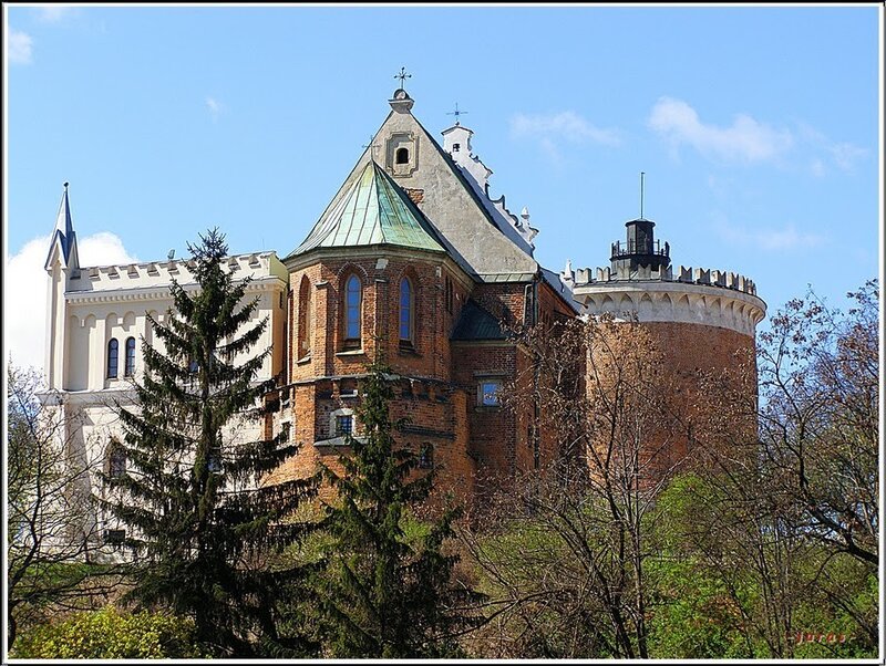 castle with green roof and tower