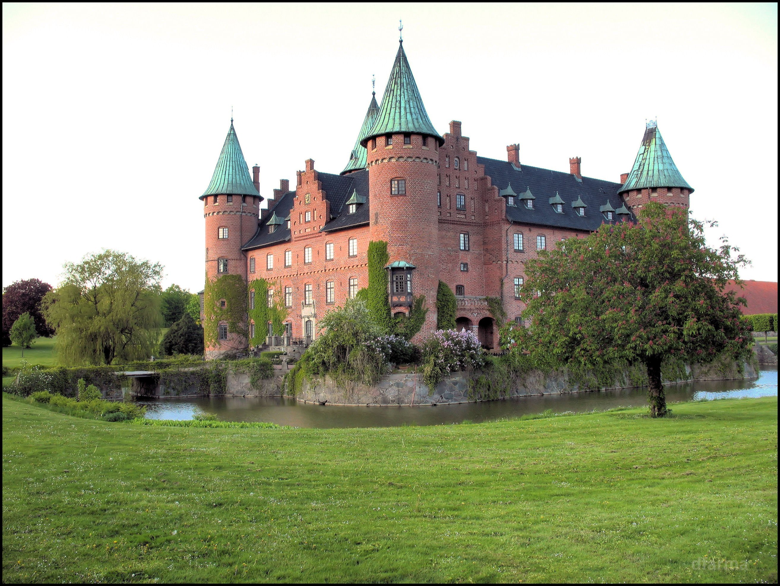 castle with green-roofed towers