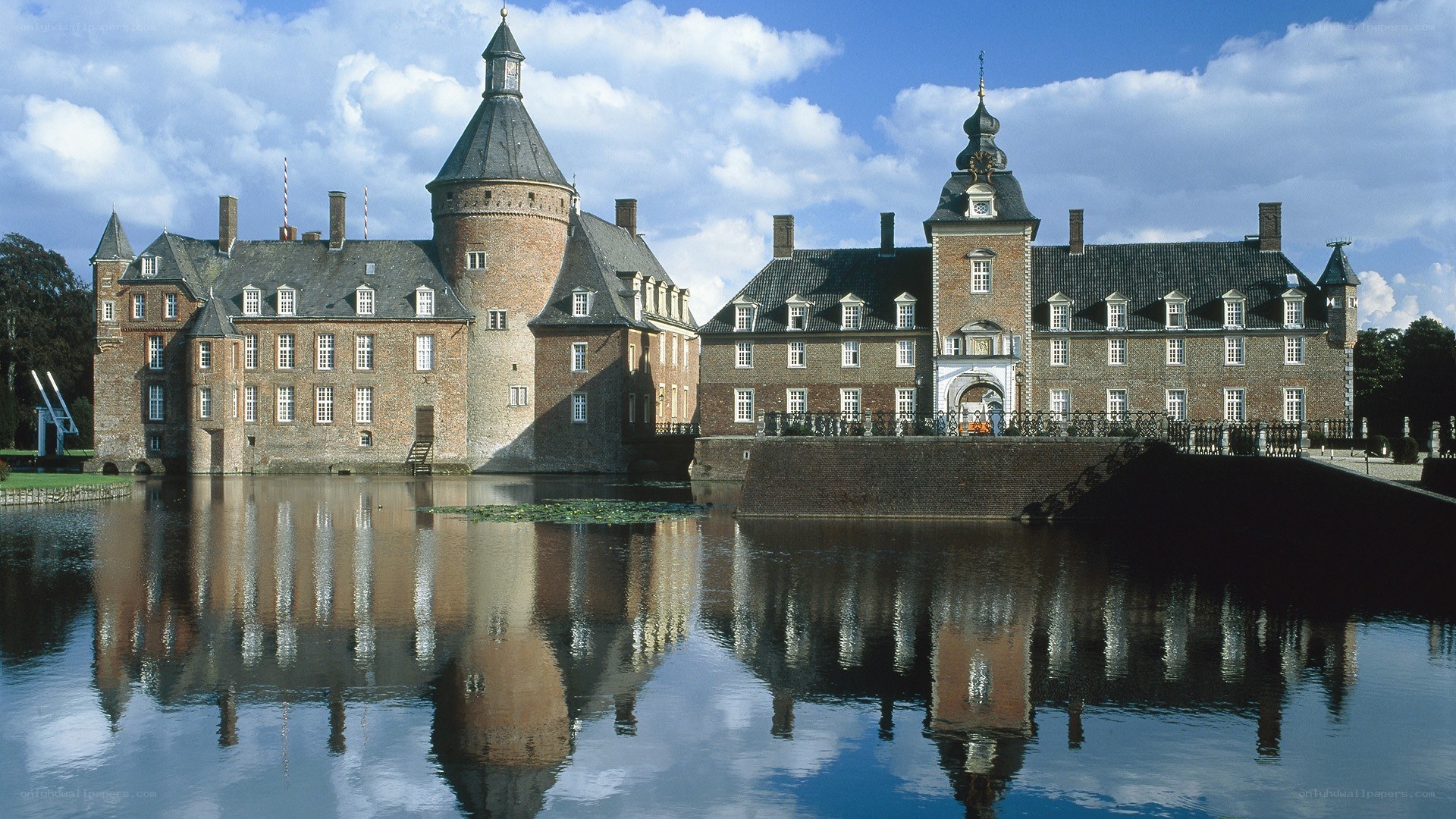 Castle with moat and reflection