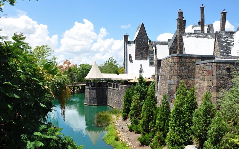 Castle with Moat — Green, Serene, Afternoon, Photograph, Trees, Tents