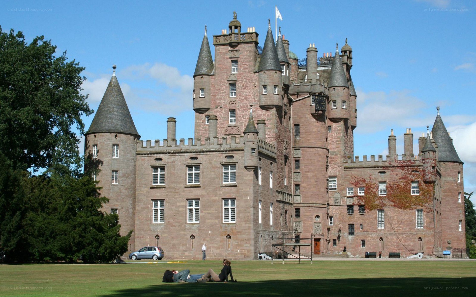 Castle with people on lawn