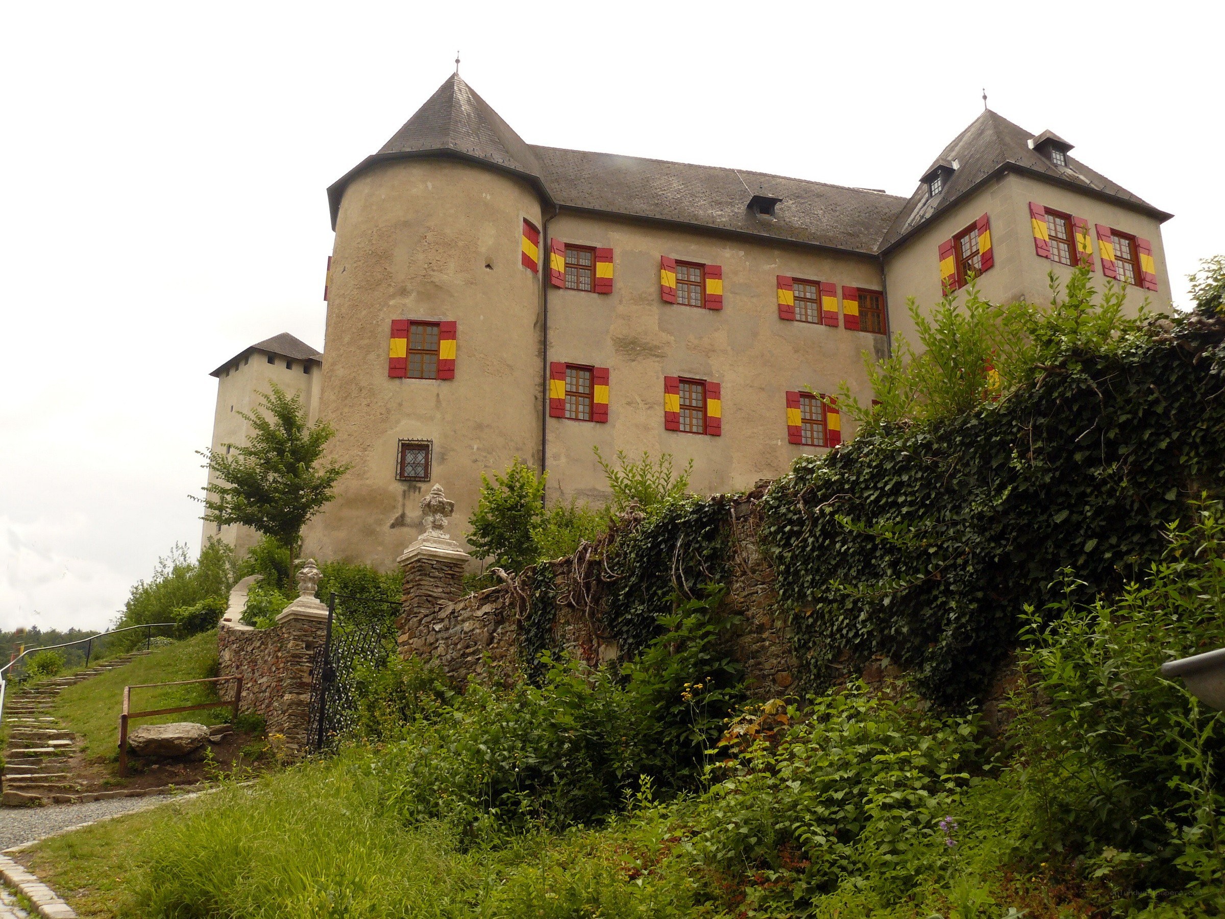 castle with red and yellow shutters