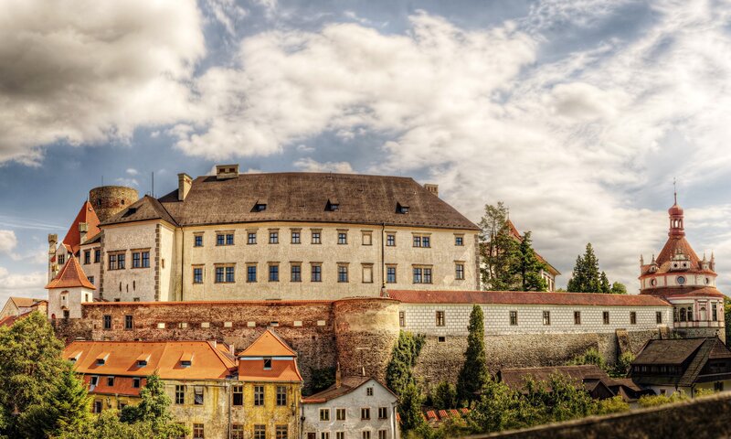 Castle with red-roofed buildings