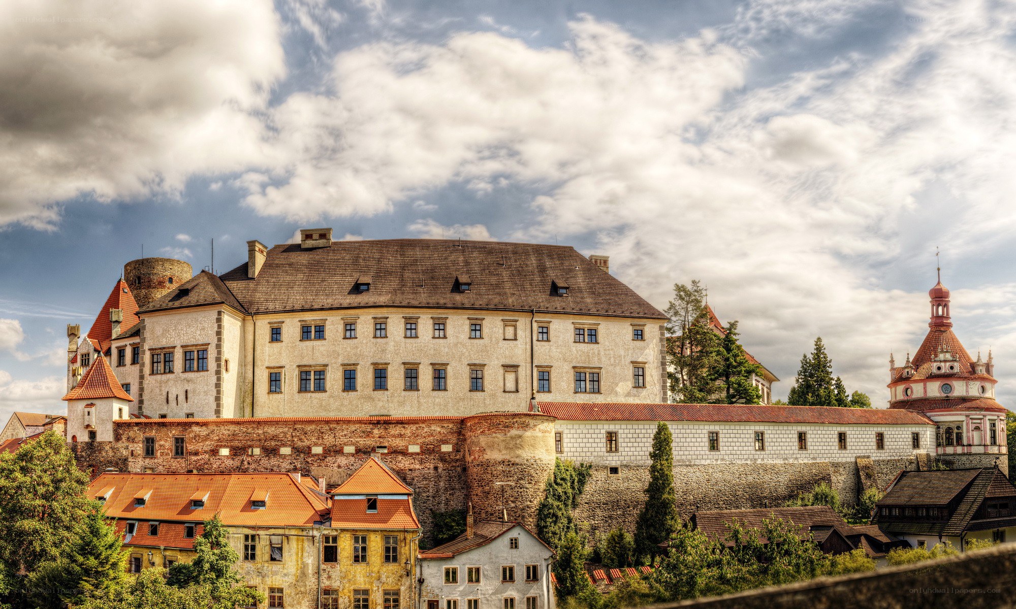 Castle with red-roofed buildings
