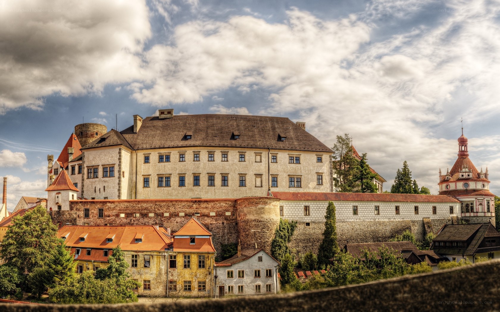 Castle with red-roofed buildings