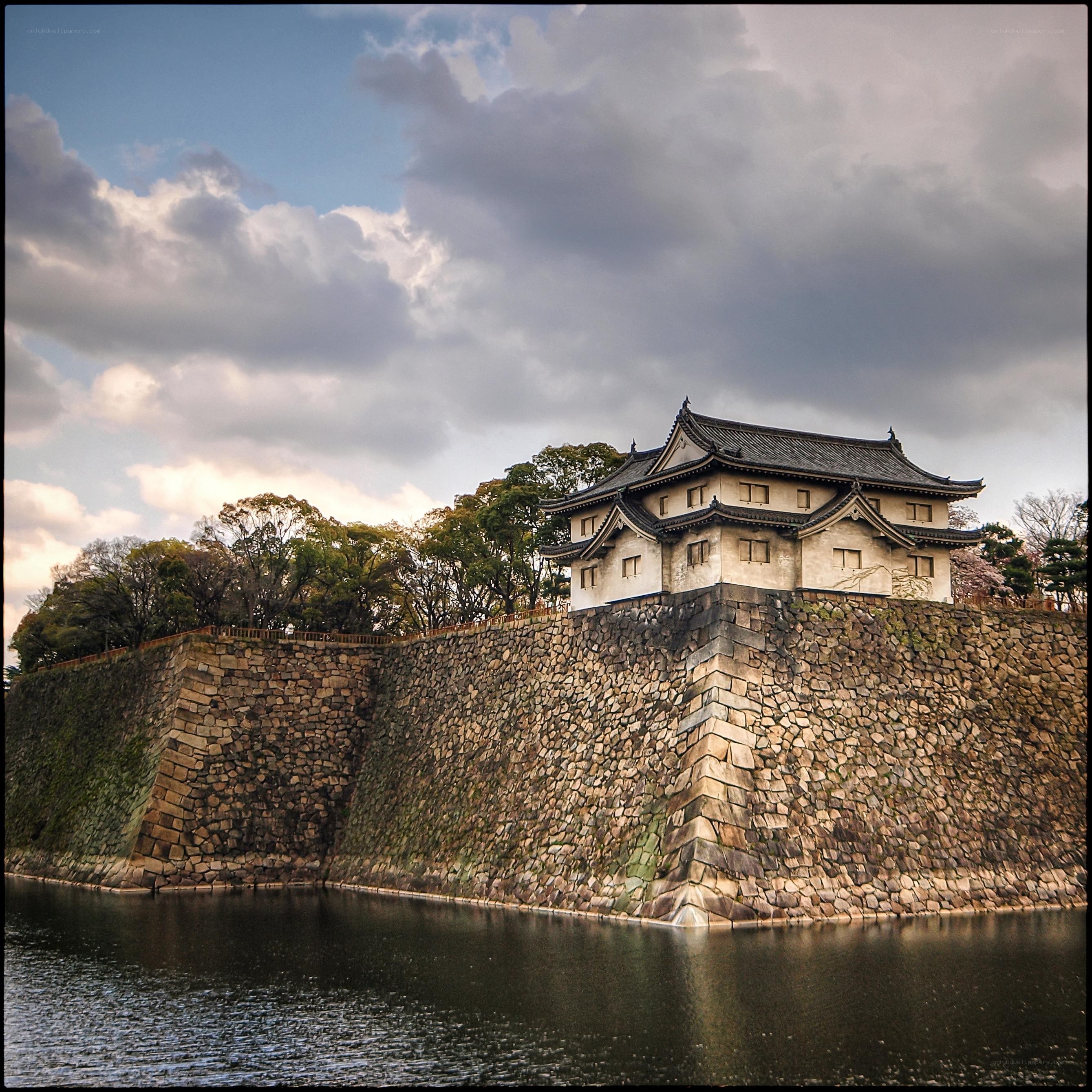 castle with stone walls and moat
