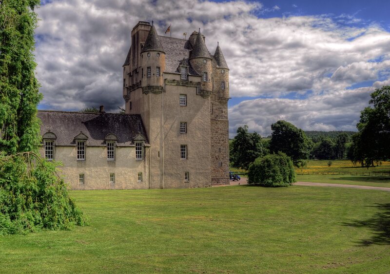 Castle with turrets and green lawn