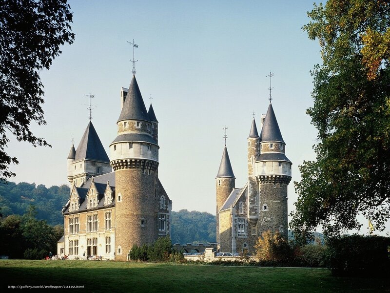 castle with turrets and green lawn