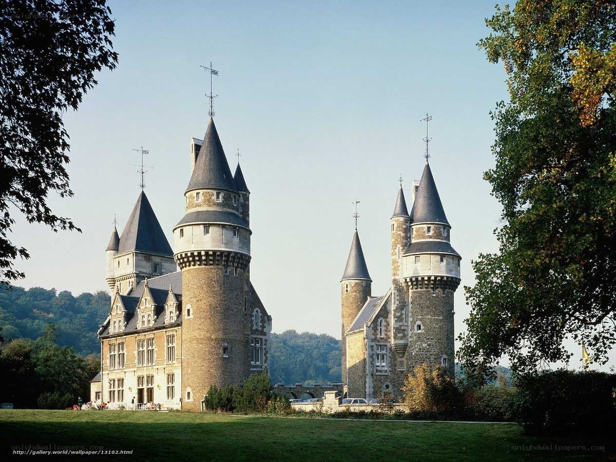 castle with turrets and green lawn