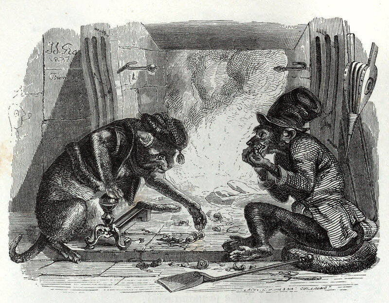 Cat and monkey by fireplace