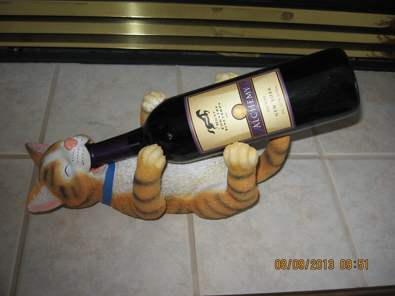 Cat Figurine Holding Wine Bottle