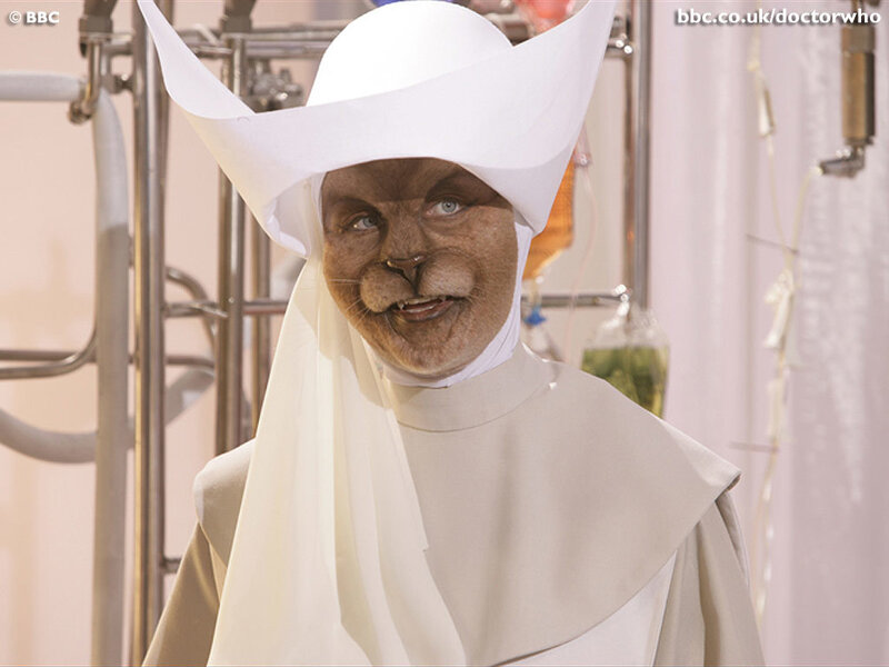 cat-like character in white robe