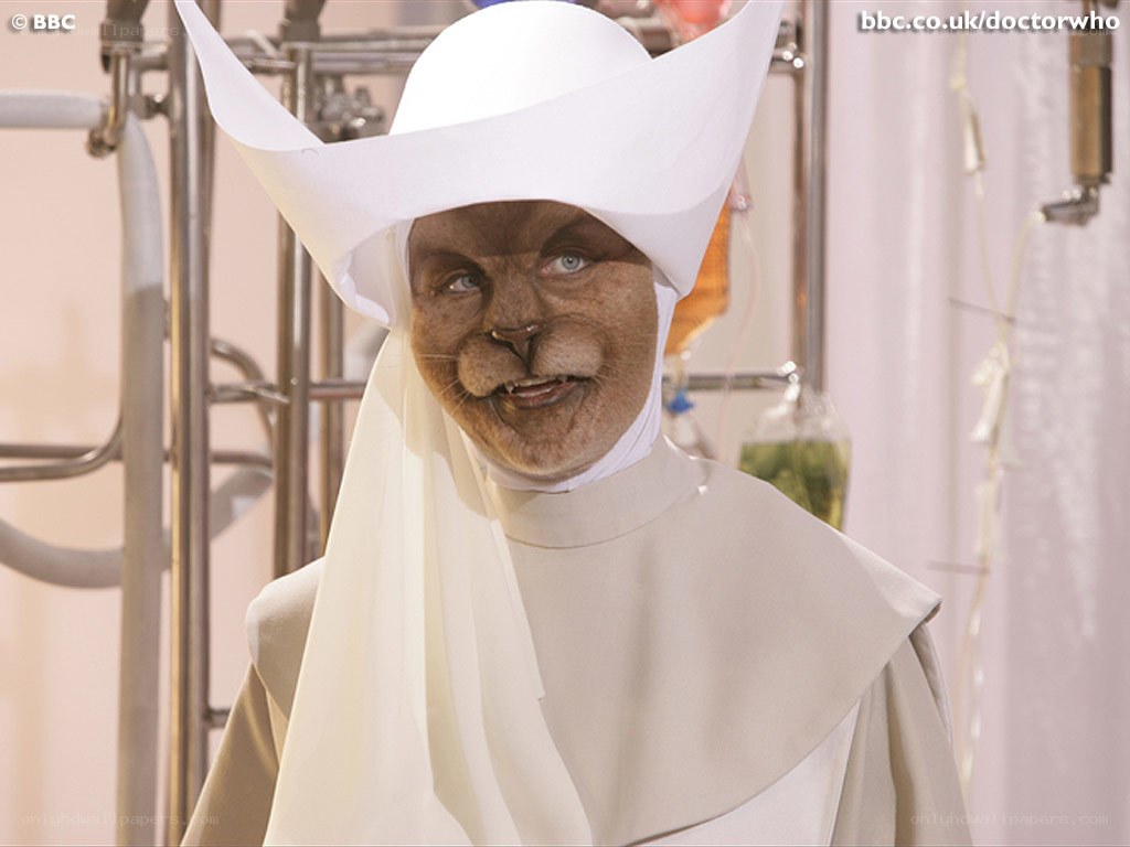 cat-like character in white robe