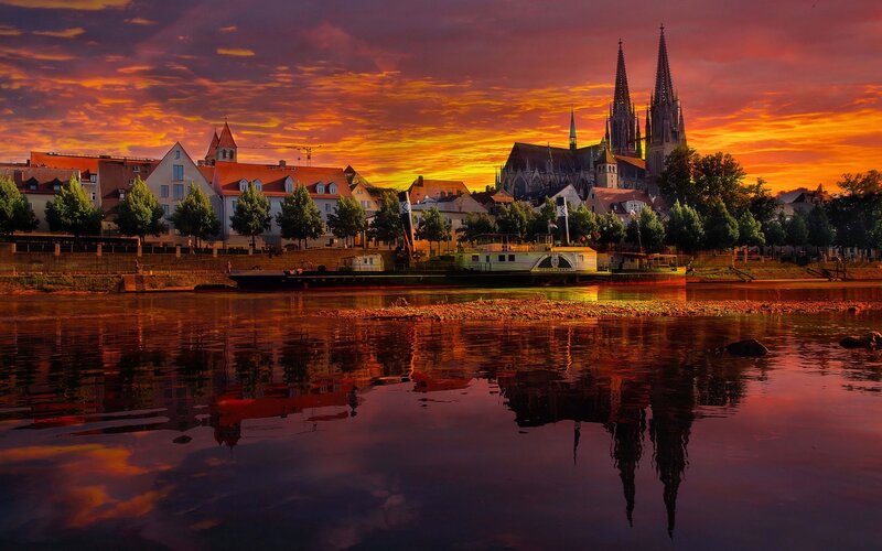 Cathedral at Sunset — Orange, Dramatic, Photograph, River, Boat, Buildings