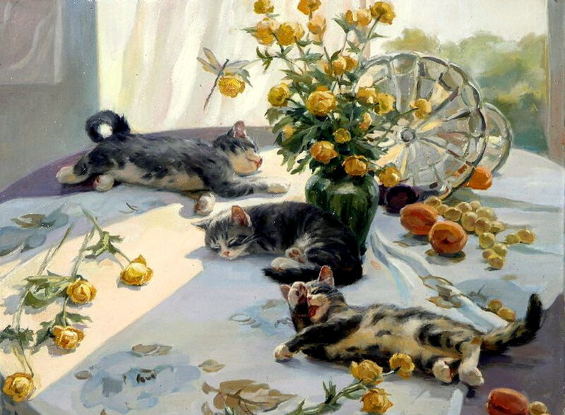 Cats and flowers on a table