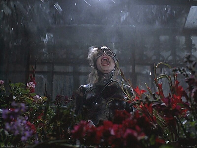 Catwoman in a greenhouse