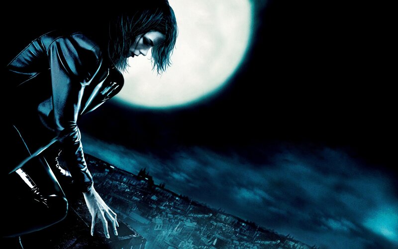 Catwoman on a rooftop at night