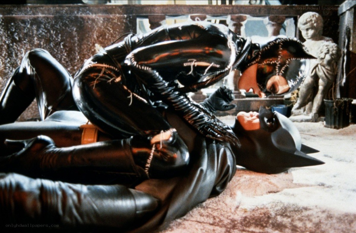 Catwoman overpowering Batman