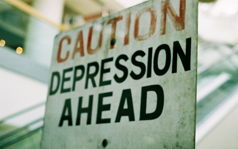 Caution Depression Ahead sign