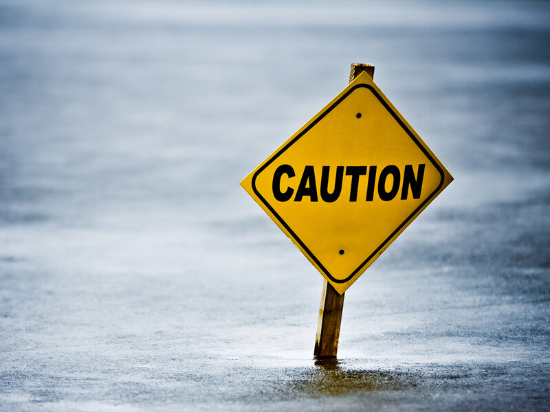 Caution sign in water