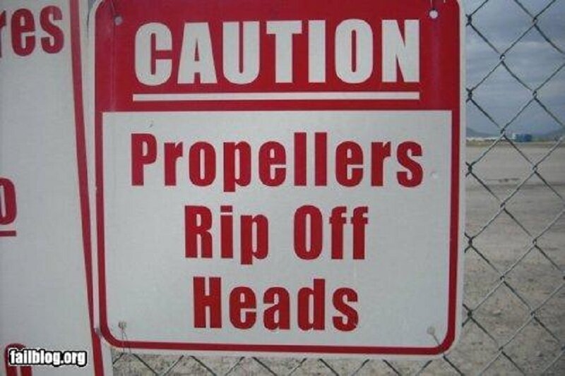 Caution Sign on Fence