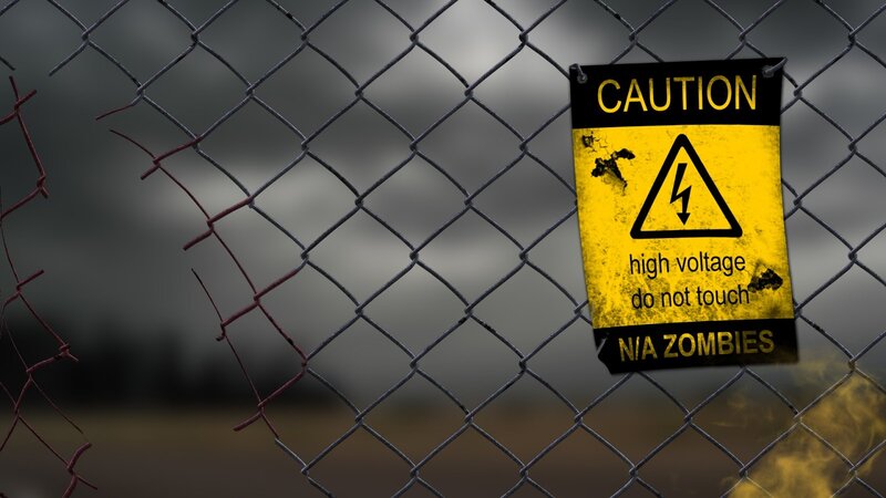 Caution Sign on Fence — Yellow