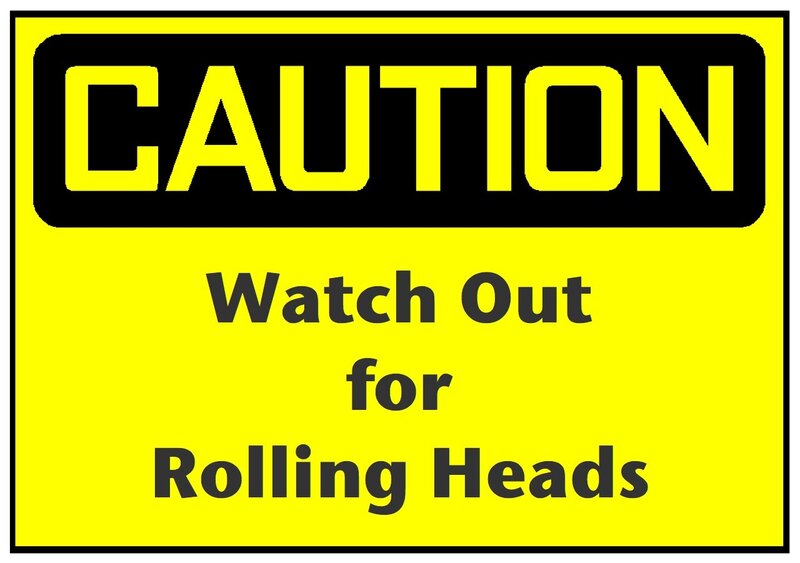 Caution sign warning of rolling heads