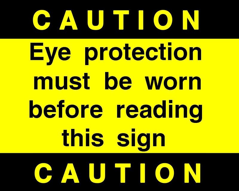 Caution sign with eye protection warning