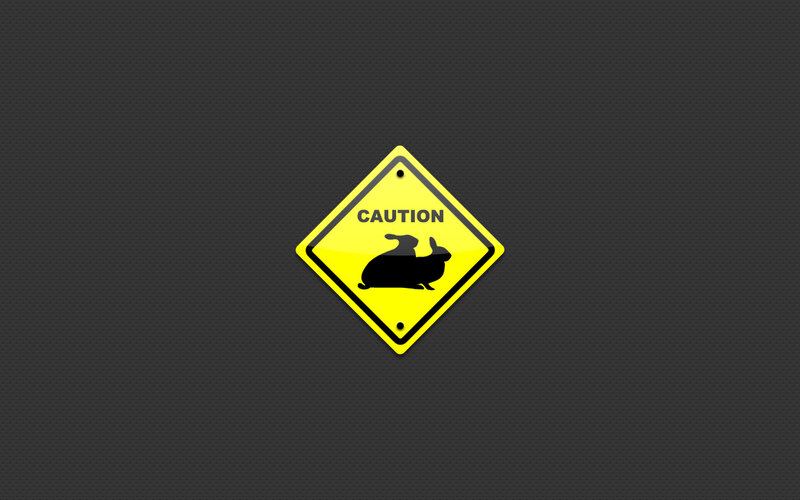 Caution sign with rabbits
