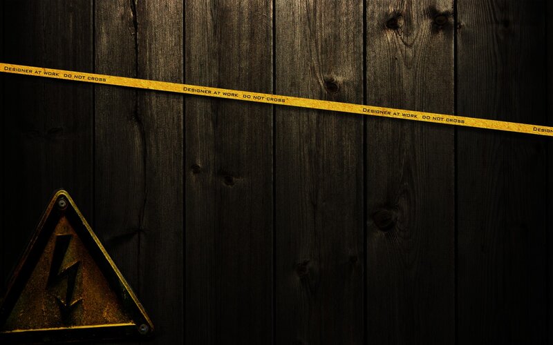 Caution tape on wooden wall