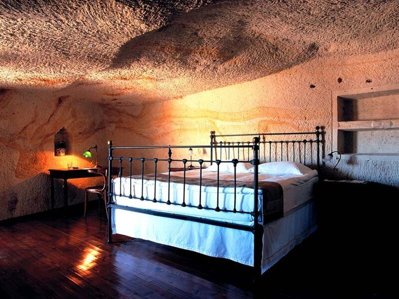 Cave bedroom with iron bed