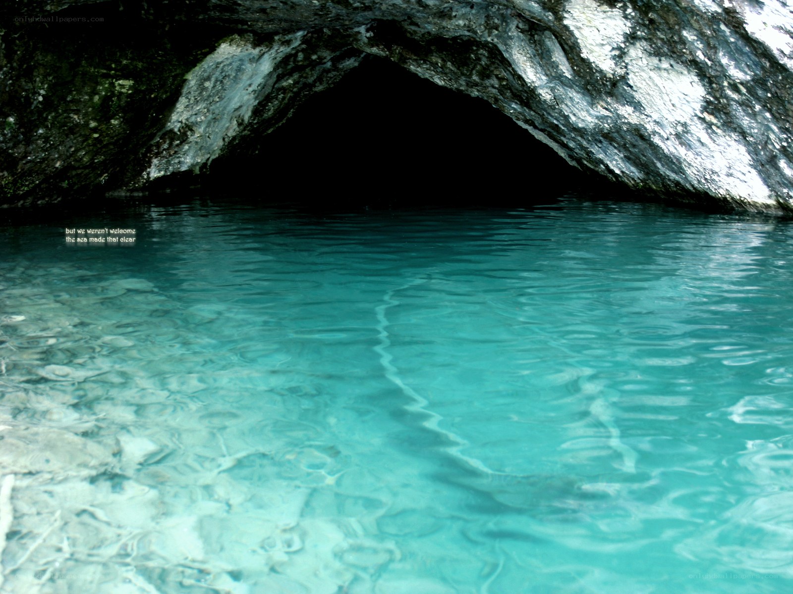 Cave entrance with clear water
