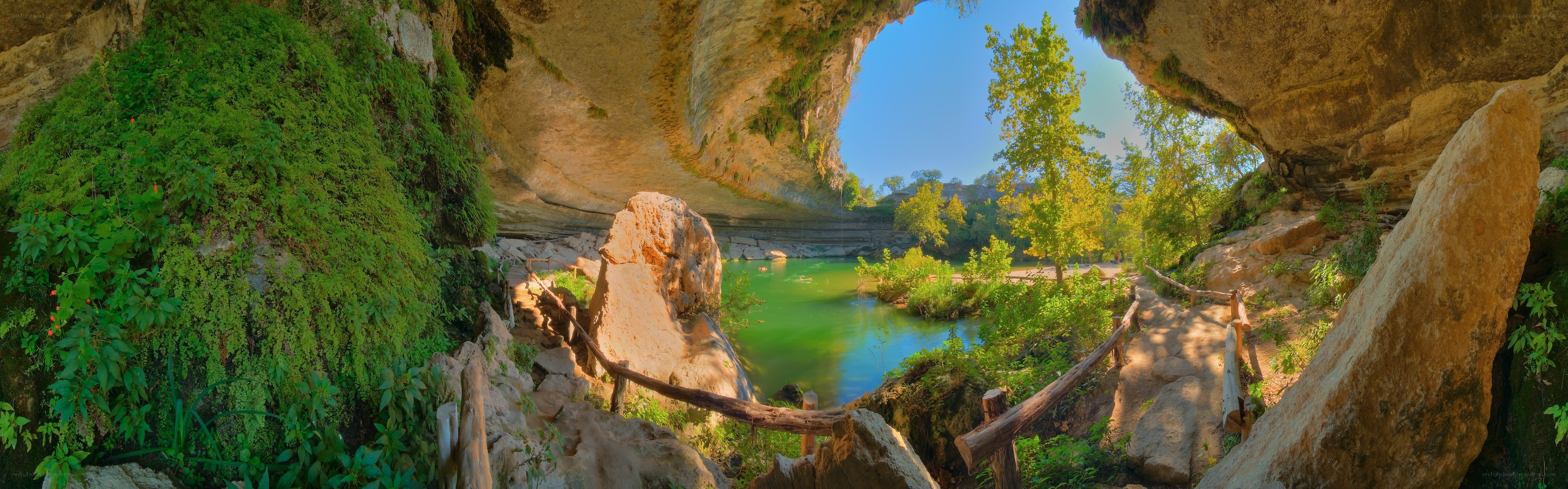 Cave entrance with green pool