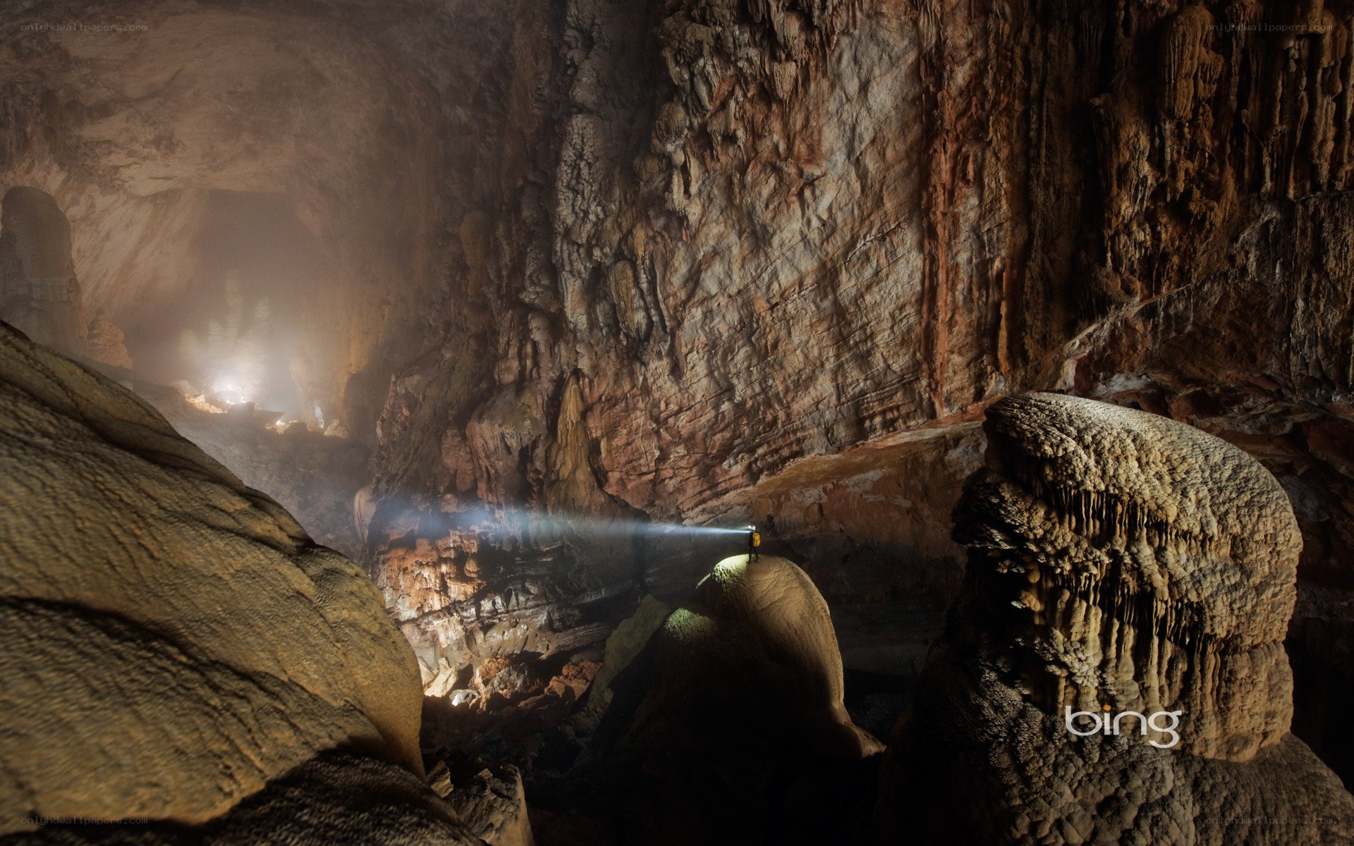 Cave explorer with flashlight