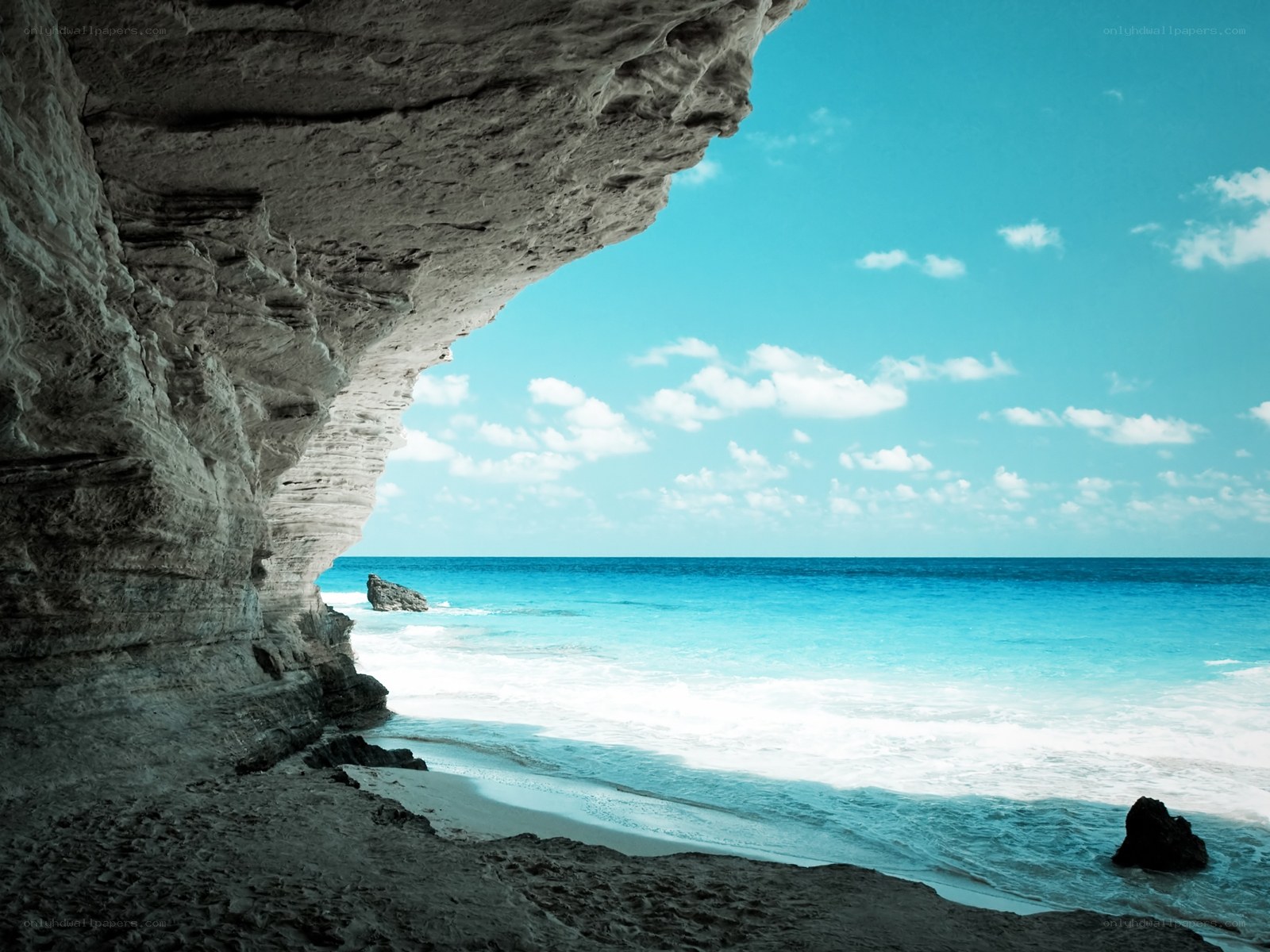 Cave view of turquoise beach