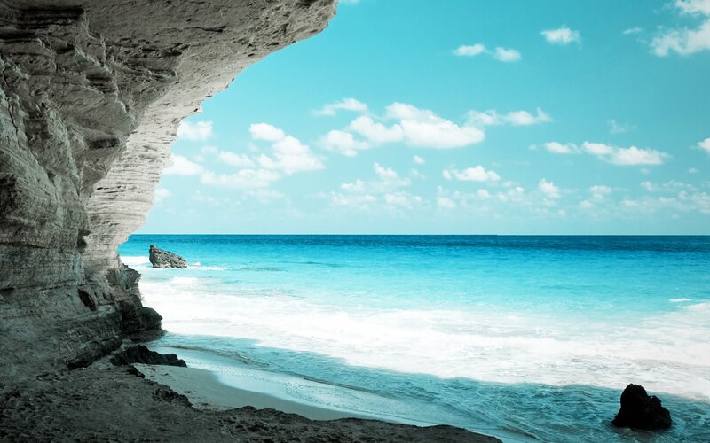 Cave view of turquoise beach