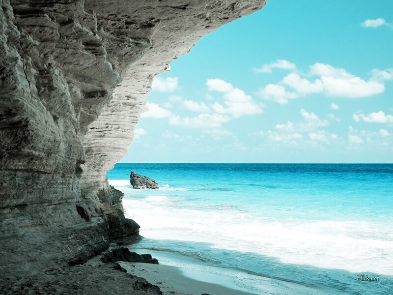 Cave view of turquoise beach