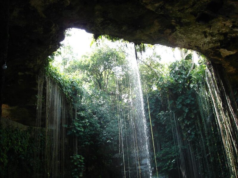 Cave waterfall in tropical forest