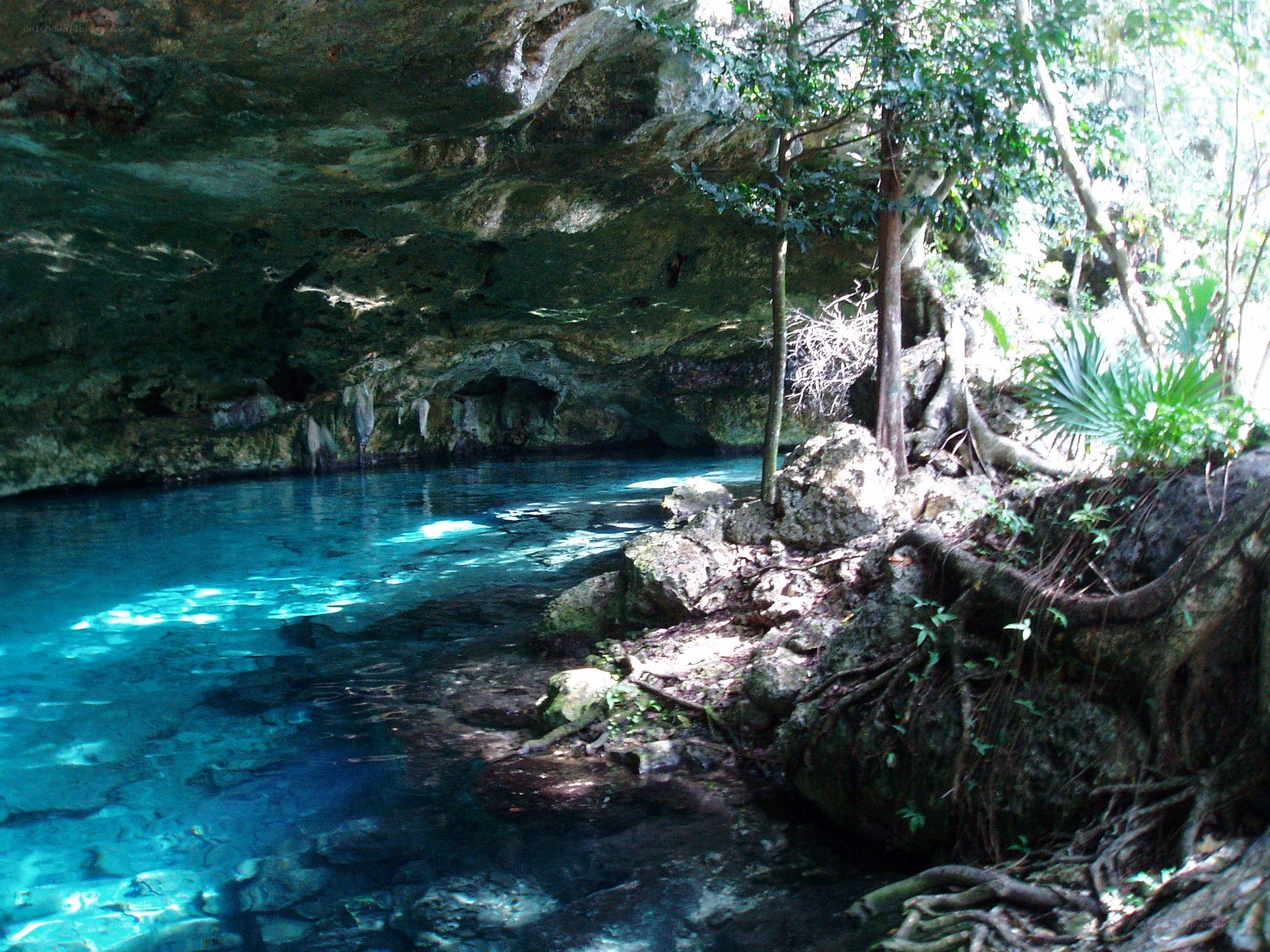 Cave with clear blue water
