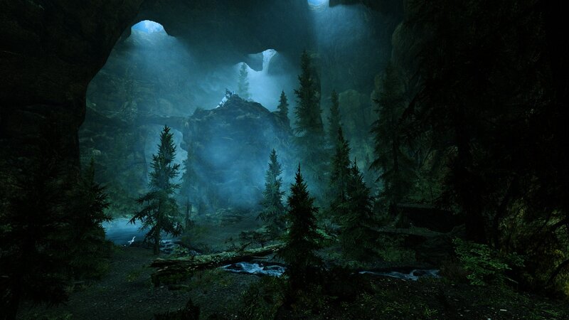 cave with forest and stream
