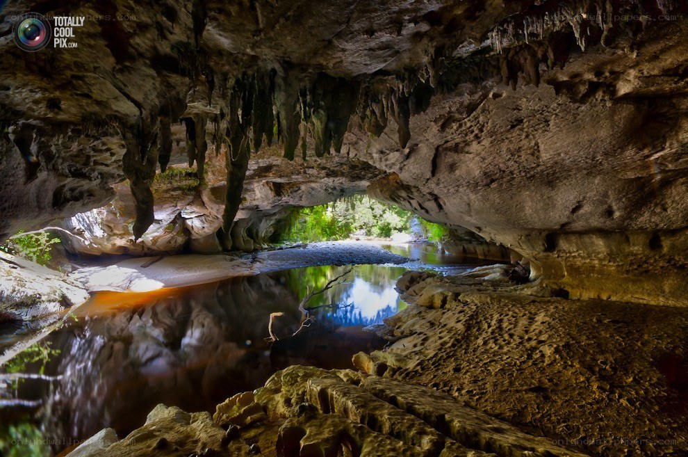 Cave with river and stalactites