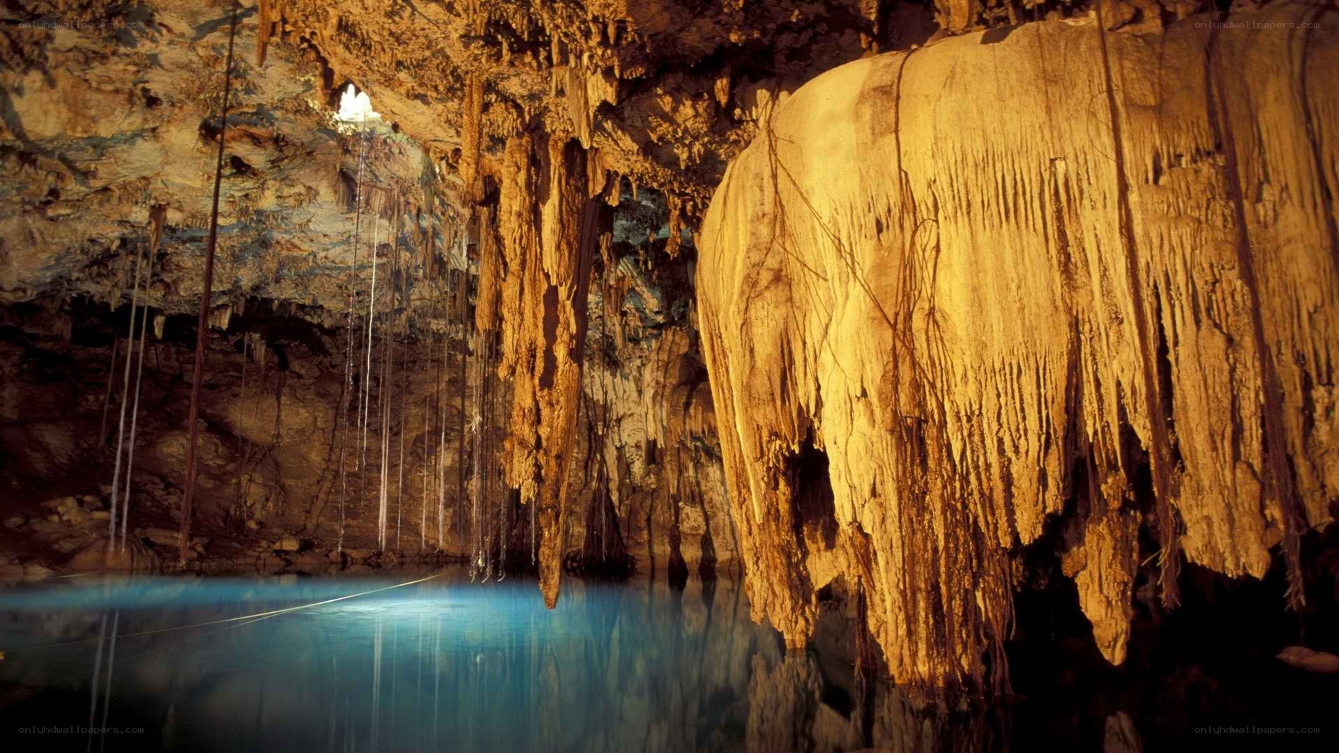 cave with stalactites and pool
